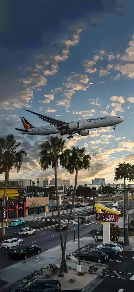 城市上空飞机降落壁纸